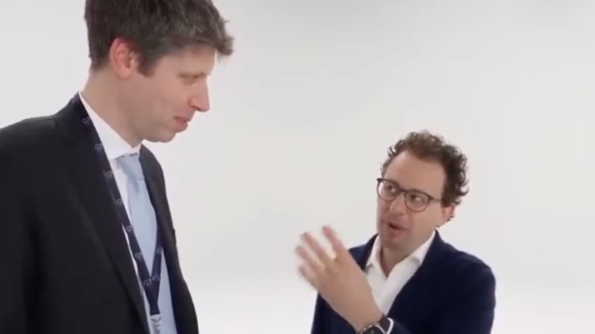 AI-generated version of the sketch: a man resembling Sam Altman in a dark suit and light-blue tie with a lanyard stands at left looking down, while a man resembling Dario Amodei with curly hair and glasses gestures toward him from the right, both against a white studio background