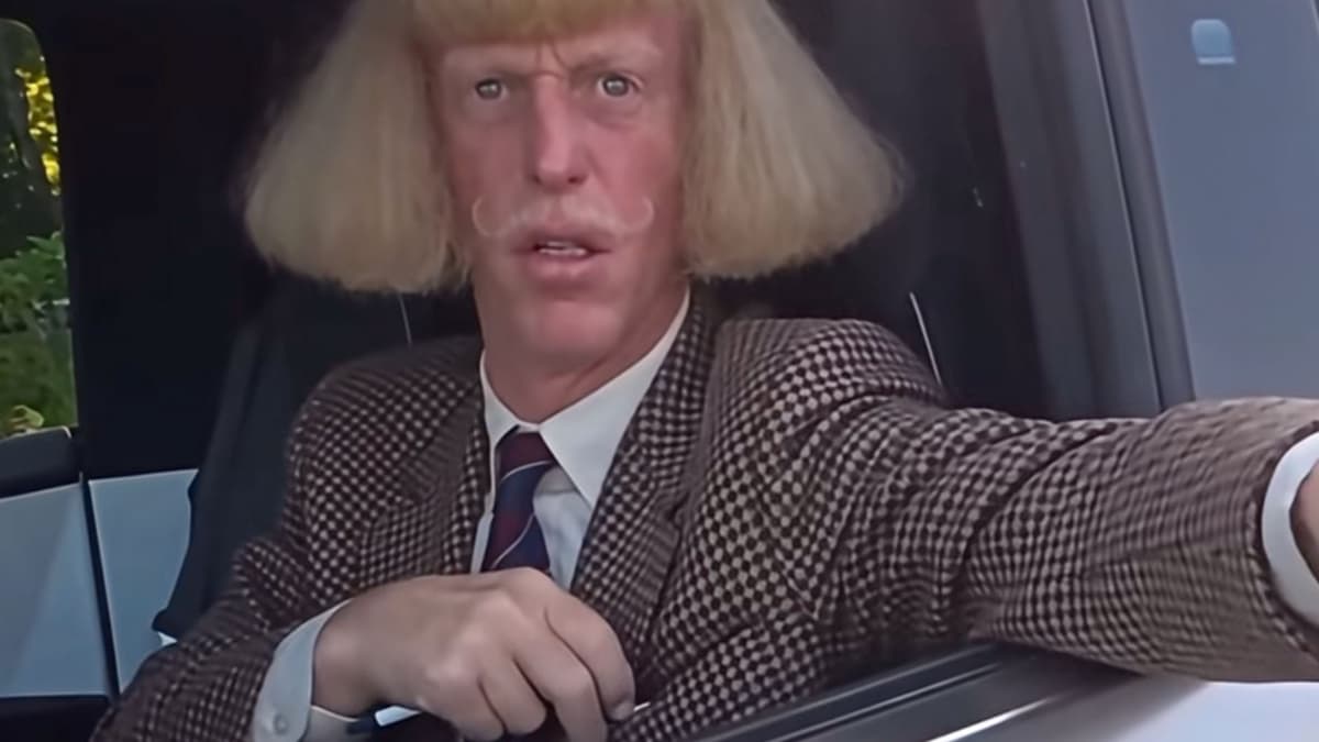 Still from an AI version of the clip: a caricatured man with a blond bob, curled mustache, and houndstooth blazer leans out of the same truck window, pointing, with the same pose and framing as the original
